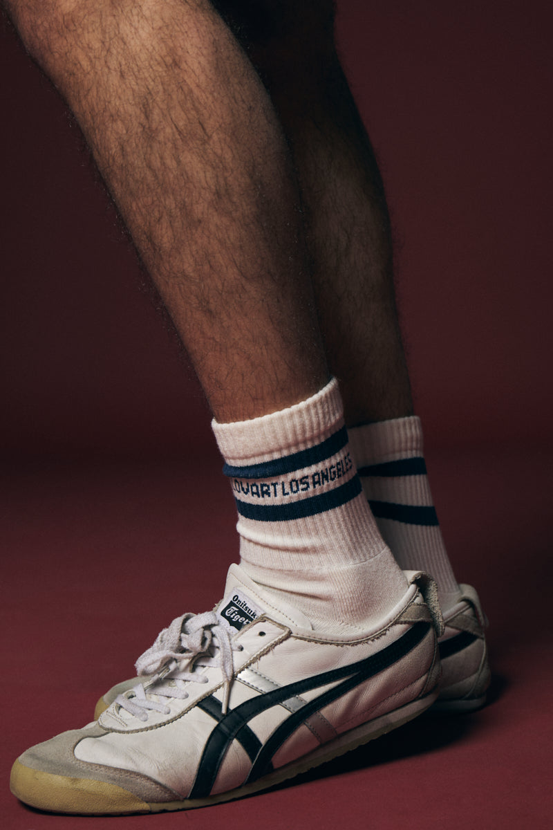 Calcetín deportivo blanco con franja azul